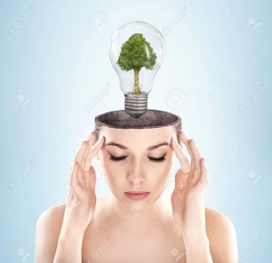 9234005-Open-minded-woman-with-green-energy-symbol-Stock-Photo-energy-think-concept