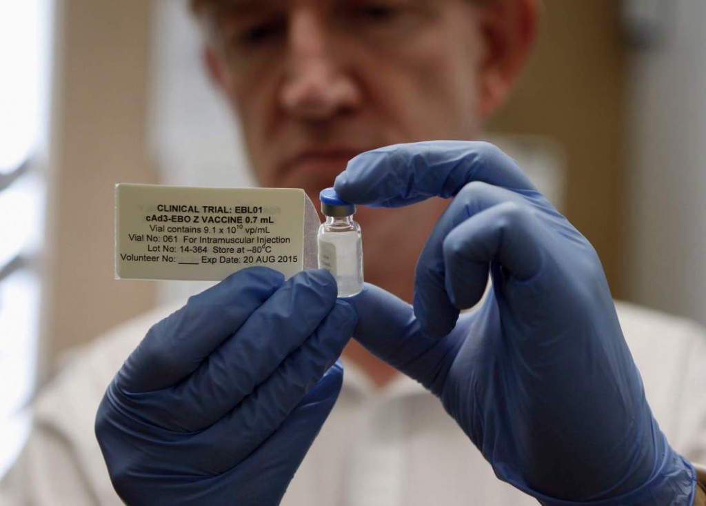 Professor Adrian Hill, Director of the Jenner Institute, and Chief Investigator of the trials, holds a phial containing the Ebola vaccine at the Oxford Vaccine Group Centre for Clinical Vaccinology and Tropical Medicine (CCVTM) in Oxford